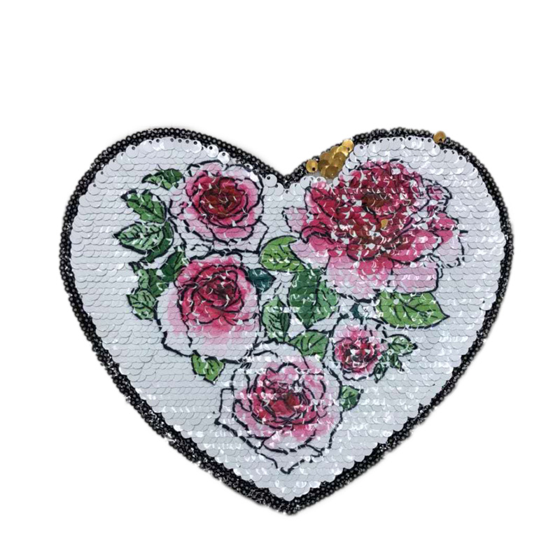 Embroidery patches with heat transfer